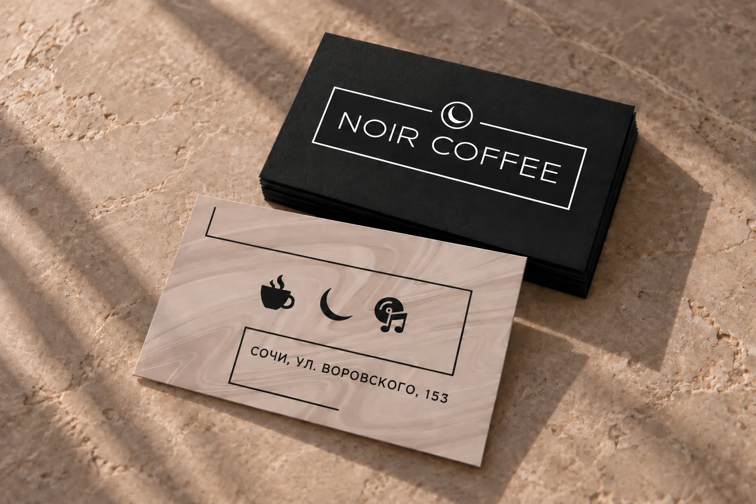 Две стороны визитки NOIR COFFEE: белый логотип на чёрном фоне и мраморный оборот с адресом Воровского, 153